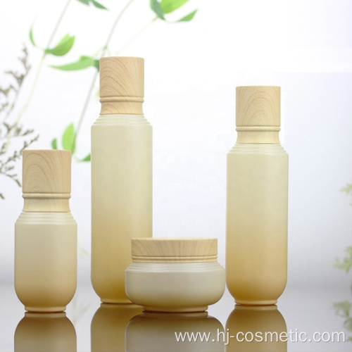 High-grade Cosmetic Gradient green glass bottles/jars with wood grain cap